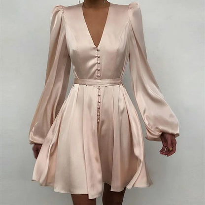 Light beige mini dress with deep V-neck and button front