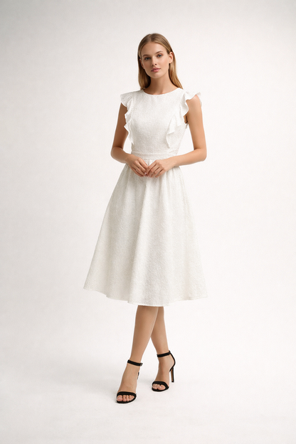 White midi dress with ruffle shoulders and textured fabric